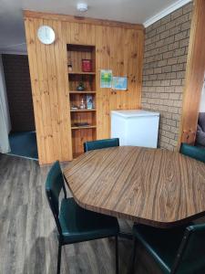 a dining room with a table and chairs at Cosy Nook - Flat 6 in Bemm River