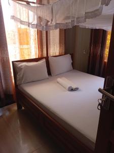 Postel nebo postele na pokoji v ubytování Rm Hotel