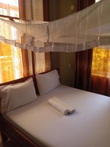 Postel nebo postele na pokoji v ubytování Rm Hotel