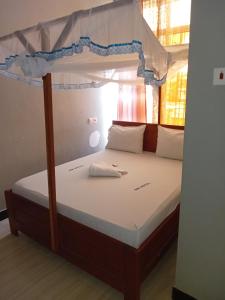 Postel nebo postele na pokoji v ubytování Rm Hotel