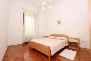 A bed or beds in a room at Apartment Riki