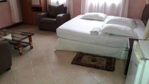 Postel nebo postele na pokoji v ubytování Rm Hotel