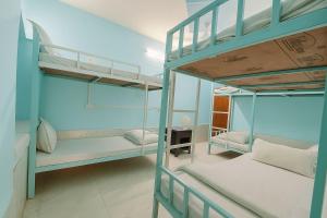 a bunk bed room with two bunk beds at Explore Hostel Life Jaisalmer in Jaisalmer