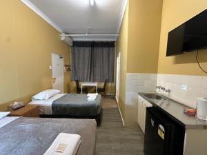 Postel nebo postele na pokoji v ubytování Central Private Hotel