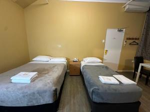 Postel nebo postele na pokoji v ubytování Central Private Hotel