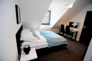 Posteľ alebo postele v izbe v ubytovaní Pure Apartments Kraków