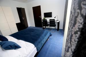Posteľ alebo postele v izbe v ubytovaní Pure Apartments Kraków
