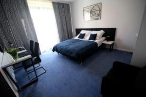 Posteľ alebo postele v izbe v ubytovaní Pure Apartments Kraków