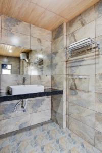 a bathroom with a sink and a shower at My Bizz Hotel Celebration Chakan in Chakan +28 photos