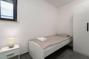 Postel nebo postele na pokoji v ubytování Premium Apartment Val de Fontane