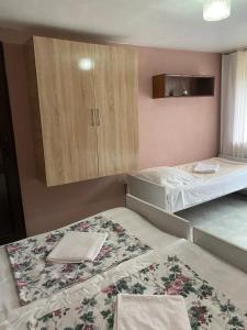 A bed or beds in a room at Vakho house