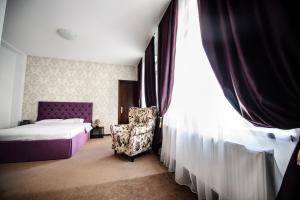 Postel nebo postele na pokoji v ubytování Coquette VILLA Mamaia Nord