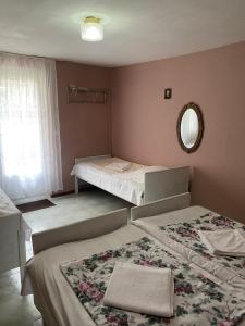A bed or beds in a room at Vakho house