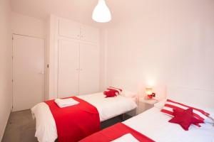 A bed or beds in a room at Granada Home Centro