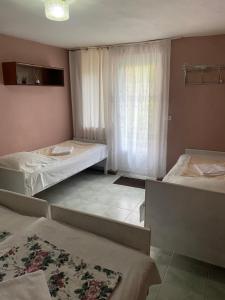 A bed or beds in a room at Vakho house