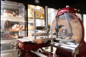 a red machine is in front of a bakery at Octant Ponta Delgada in Ponta Delgada
