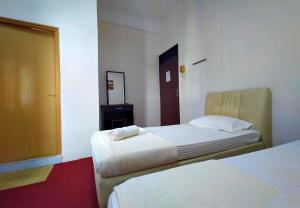 Postel nebo postele na pokoji v ubytování Rz Gold Hotel Official Account