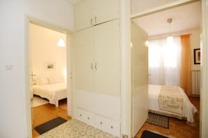 Posteľ alebo postele v izbe v ubytovaní Prokonzul 2BR apartment in old town