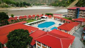 an aerial view of a resort with a swimming pool and a beach at Kwality Beach Resort in Beni Ghāt