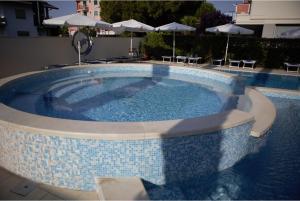 The swimming pool at or near Mare Blu Residence
