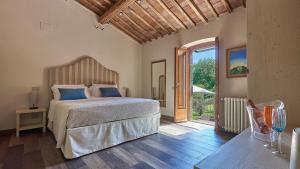 Postel nebo postele na pokoji v ubytování La Corte del Chianti Classico