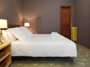 Postel nebo postele na pokoji v ubytování Fewdays Barcelona Apartments + 37 fotografií