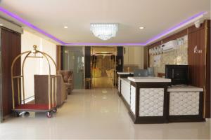 a lobby with a luggage cart in a hotel room at شقق الكادي in Najran