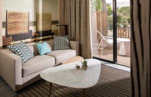 a living room with a couch and a coffee table at Thalazur Arcachon in Arcachon