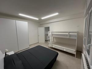 Ένα ή περισσότερα κρεβάτια σε δωμάτιο στο Casa Vacanza Conchiglia