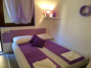 Postel nebo postele na pokoji v ubytování Apartments Nina