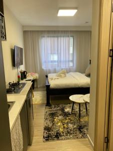 a small bedroom with a bed and a window at Sure Stay Homes in Gatunga