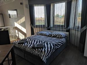 Postel nebo postele na pokoji v ubytování Apartament Perła Pienin