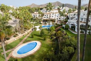 an aerial view of a resort with a large swimming pool at Tetuan 43 - Oasis Properties in Nerja