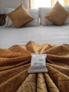 a bed with a thermometer on top of it at Mount Teena in Anachal