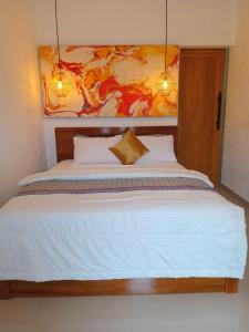 Ένα ή περισσότερα κρεβάτια σε δωμάτιο στο South Island Bali -Near Uluwatu