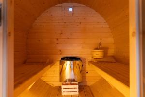 a sauna with two beds in the middle at Domki z bali na miedzy in Piwniczna +28 photos