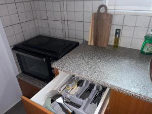a kitchen with a stove and a counter top at Chrisa's Apartments 1 in Missolonghi