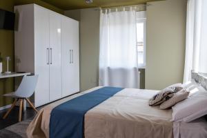 Postel nebo postele na pokoji v ubytování B&B Poli Opposti