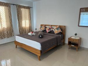 Ένα ή περισσότερα κρεβάτια σε δωμάτιο στο Vakaloa Holiday Home