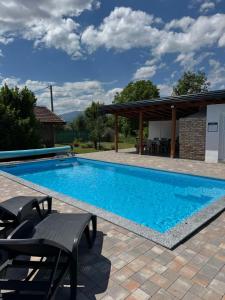 a swimming pool in a backyard with a pavilion at Crystal pool in Bihać