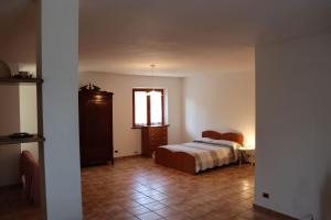 A bed or beds in a room at La Casa de Anto'