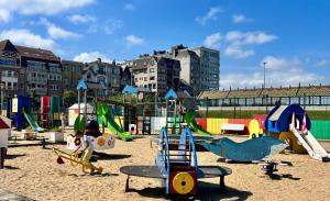 a playground with many different types of playground equipment at Appartement Anthony in Blankenberge