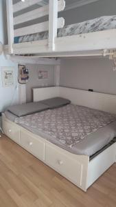 a bed in a room with two bunk beds at A casa di Alessia in Santa Maria delle Mole