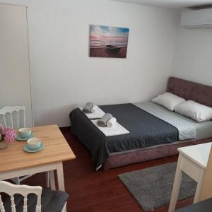 Postel nebo postele na pokoji v ubytování Apartman Tristan
