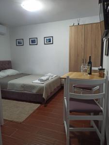 Postel nebo postele na pokoji v ubytování Apartman Tristan