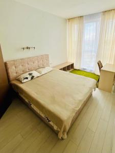 Ένα ή περισσότερα κρεβάτια σε δωμάτιο στο New Apartments