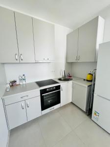 Η κουζίνα ή μικρή κουζίνα στο New Apartments