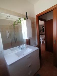 a bathroom with a white sink and a mirror at Relix in Càbras