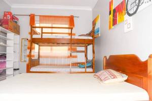 a room with two bunk beds and a bed at HawiHomes in Mombasa