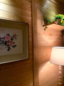 a room with a wall with a picture and a lamp at 스테이 편차 in Pyeongchang 